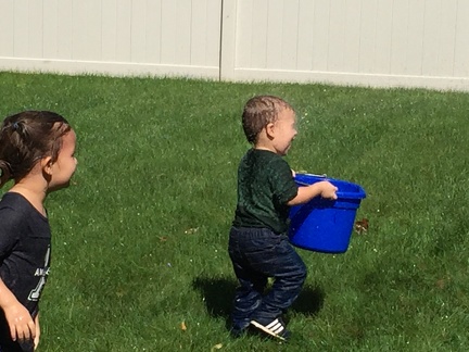 Getting sprayed with the hose by daddy4